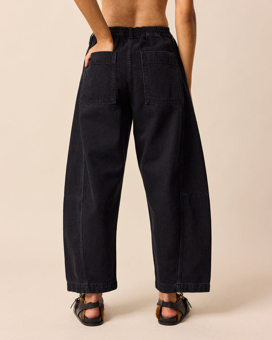 model wears tori washed black denim jeans back