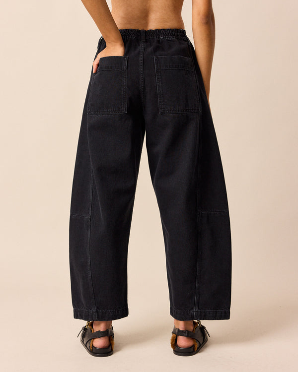 model wears tori washed black denim jeans back