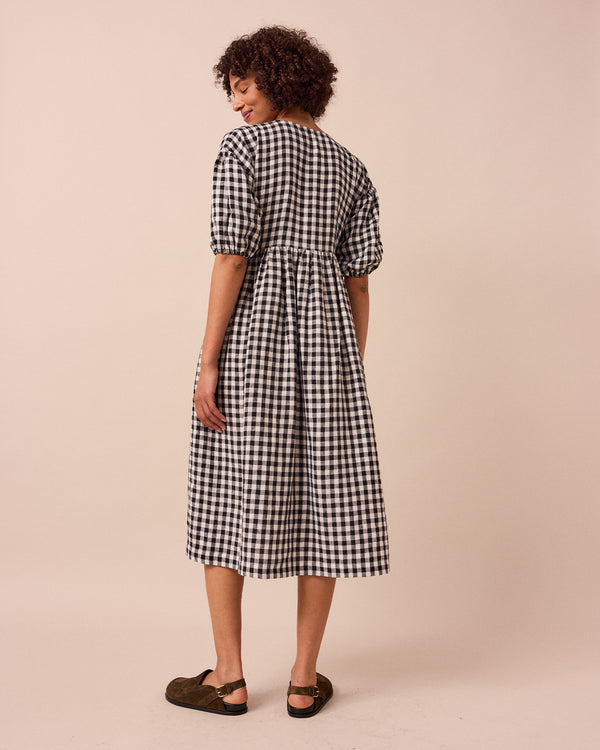 model wears winnie black and white gingham linen dress