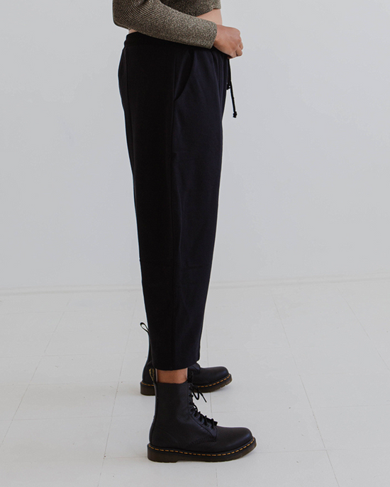 model wears black jersey jenny trousers right