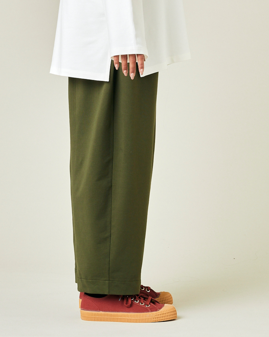 model wears olive jersey mabel trousers right