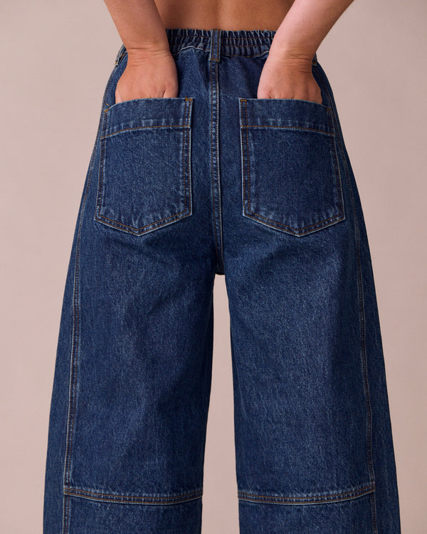 model wears echo mid wash denim jeans right