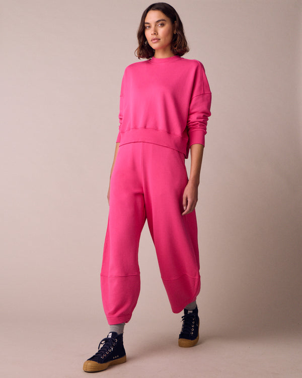 model wears eden hot pink fleeceback jersey jumper