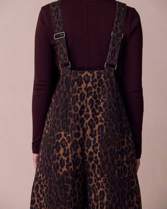 model wears ottie dark leopard denim jumpsuit