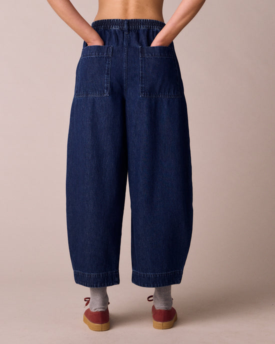 model wears veda dark wash denim jeans back