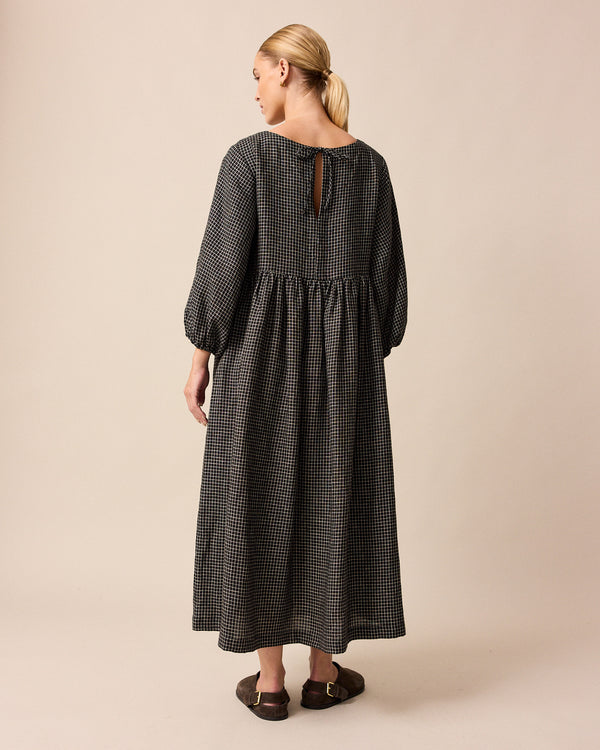 model wears berlin black mini grid linen dress