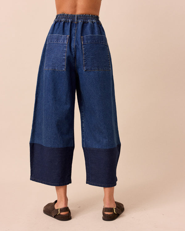 model wears blair mid wash denim jeans back