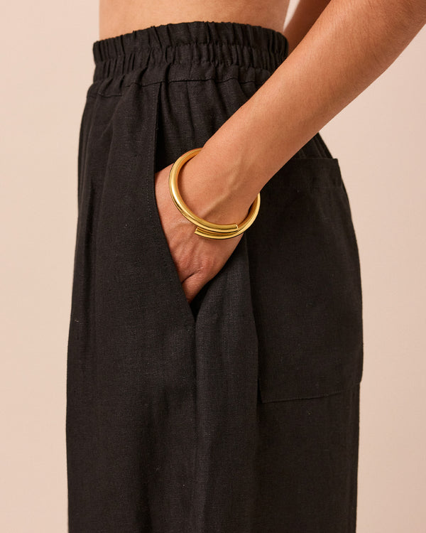 model wears black bobbi linen trousers 