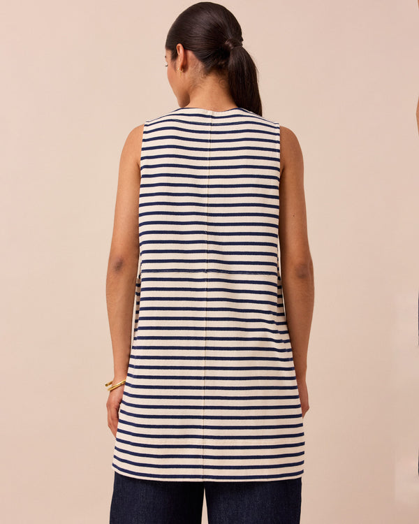 model wears a bree navy and ecru stripe tunic