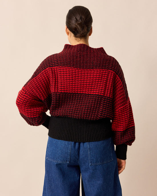 model wears chelsea red and black check knitted jumper