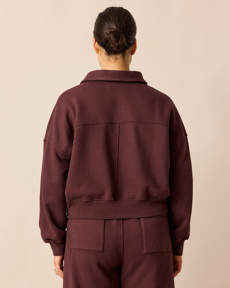 model wears cleo burgundy jersey jumper