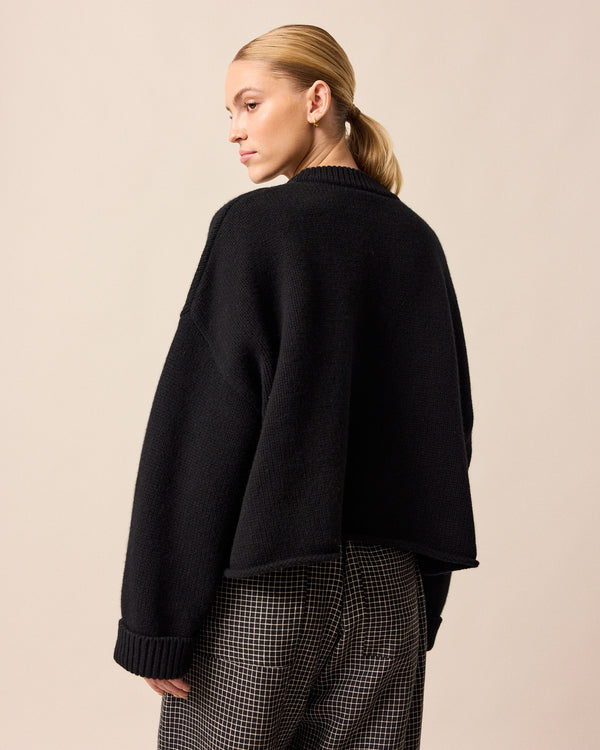 model wears coco black knitted jumper