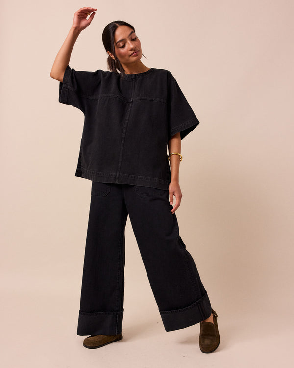 model wears deedee washed black denim top