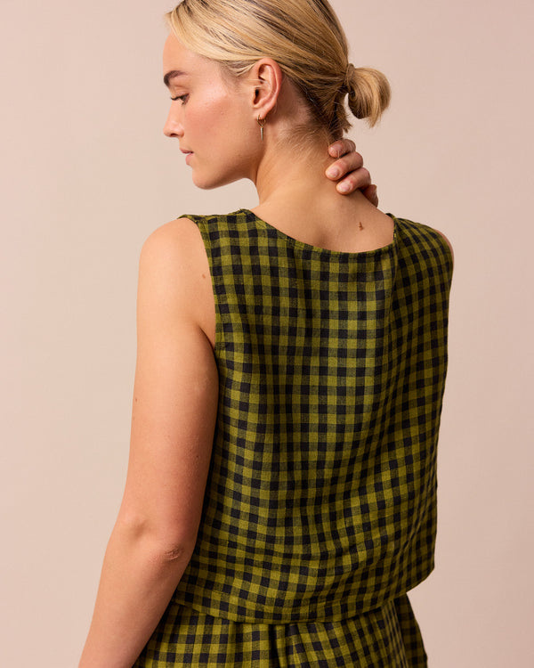 model wears green gingham linen esme top