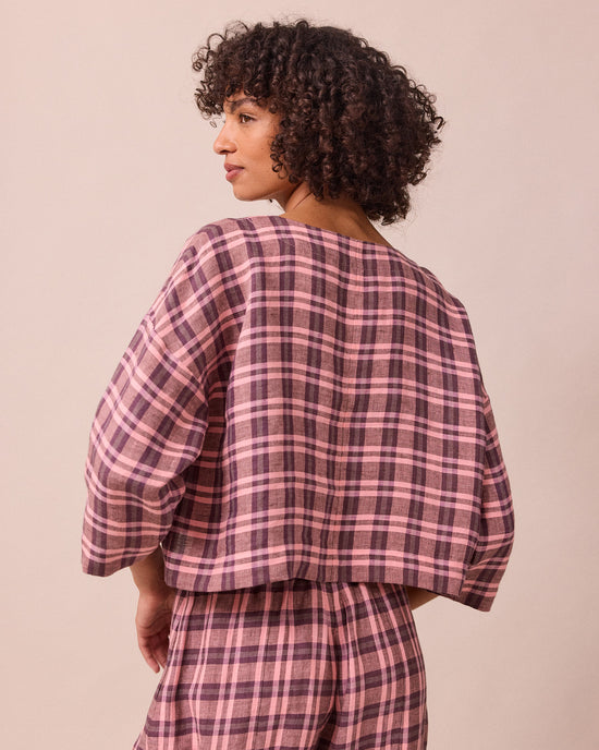 model wears lily dewberry check linen top