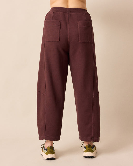 back model wears lyra burgundy fleeceback jersey trousers