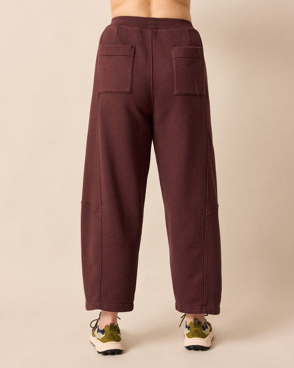 back model wears lyra burgundy fleeceback jersey trousers