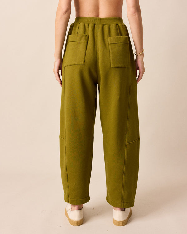model wears lyra fresh olive jersey trousers back