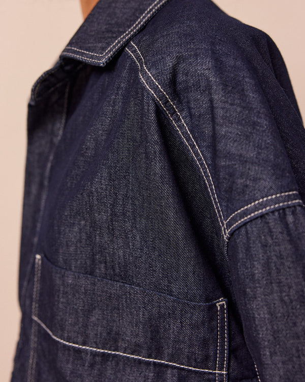 model wears olla indigo wash denim shirt