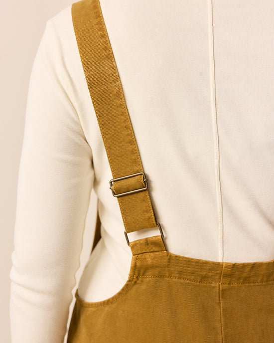 model wears ottie bronze denim jumpsuit