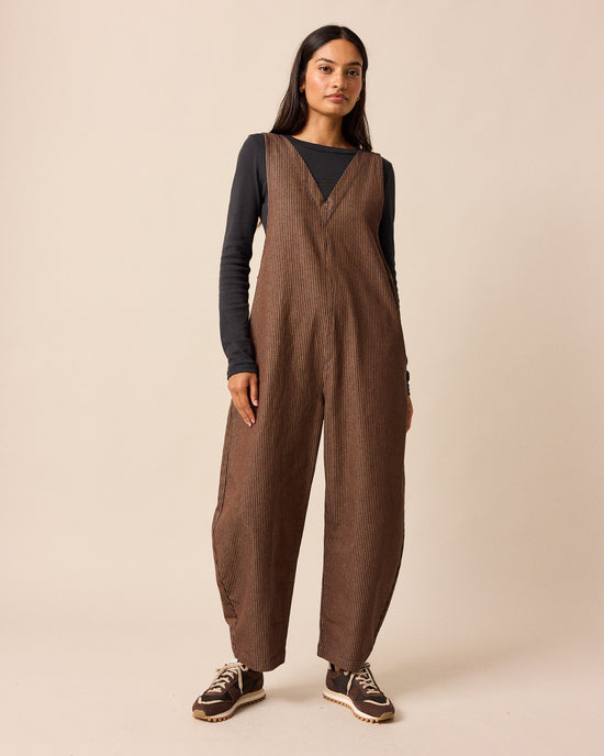model wear ottie rust hickory stripe denim jumpsuit