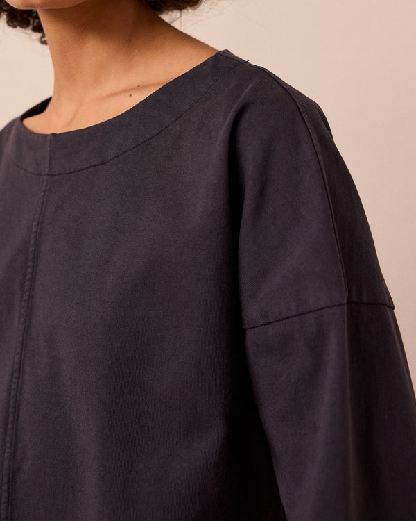 model wears peggy washed black jersey top