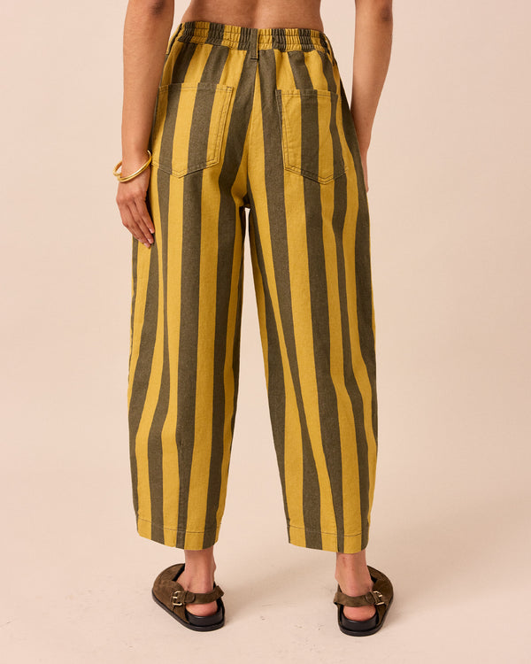 model wears citrine and forest stripe remi denim jeans back