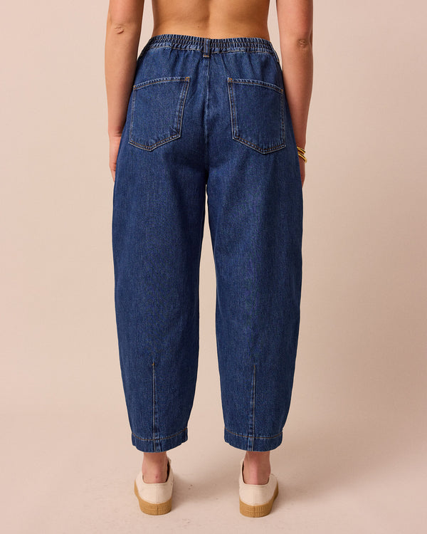 model wears remi mid wash denim jeans back