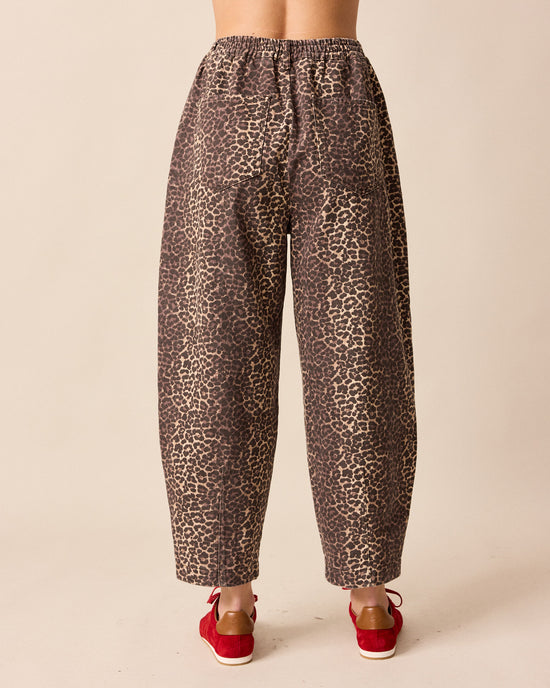 model wears remi leopard print denim jeans back