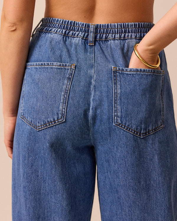 model wears remi true blue denim jeans right