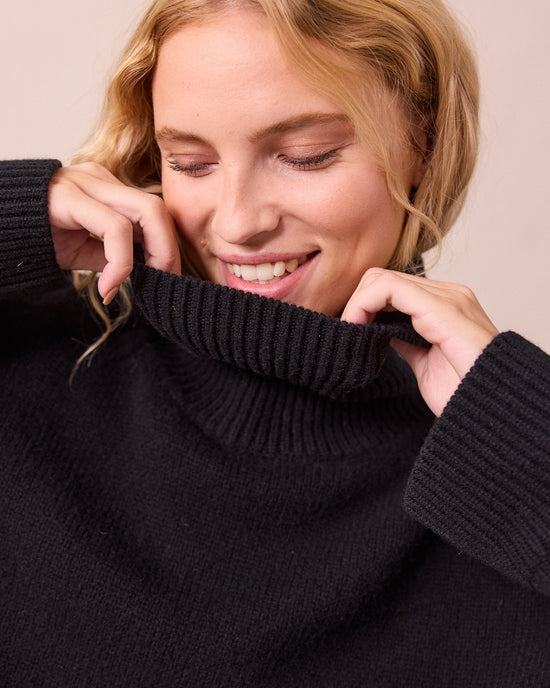 model wears ruth black knitted jumper