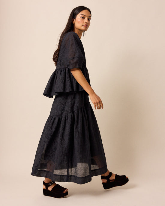 model wears talia black organza skirt