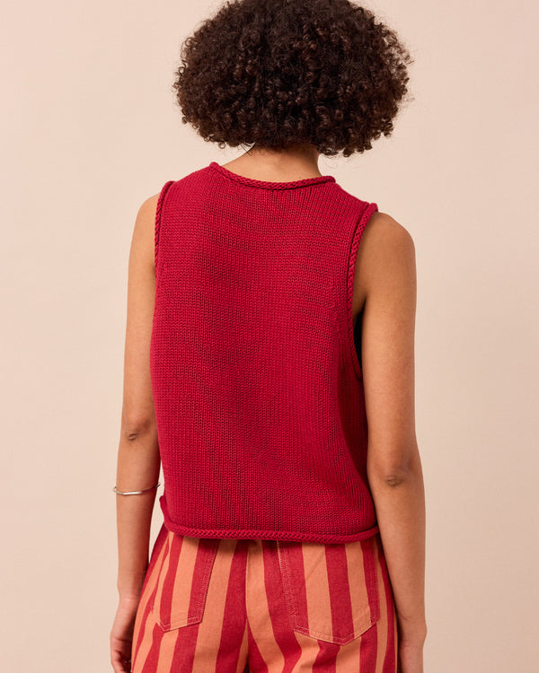 model wears tyler cranberry knitted vest