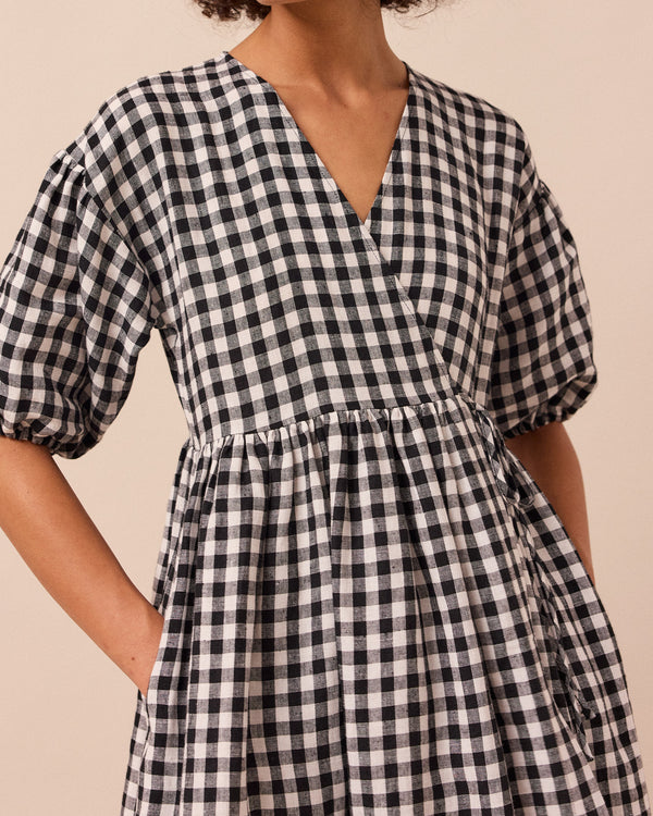model wears winnie black and white gingham linen dress
