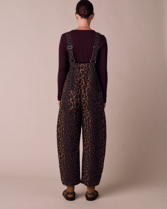 model wears ottie dark leopard denim jumpsuit