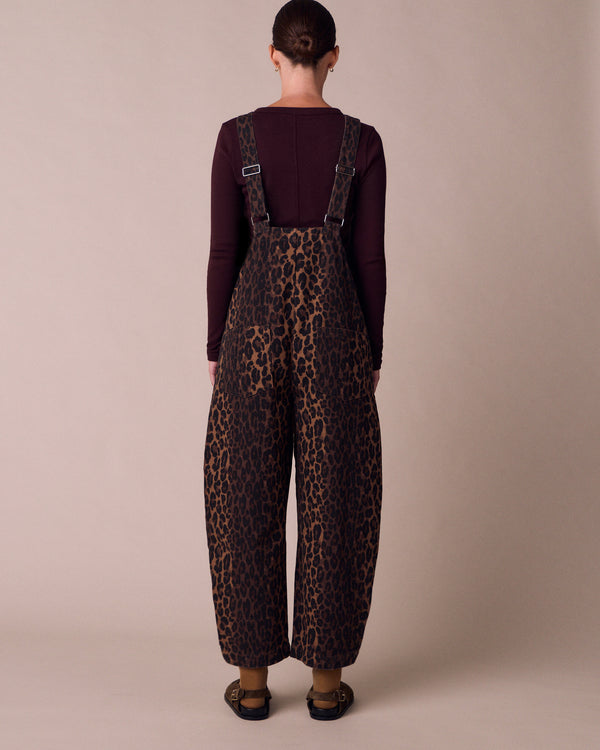 model wears ottie dark leopard denim jumpsuit