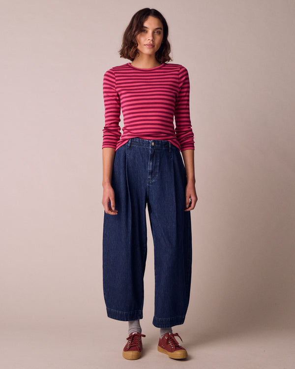 model wears veda dark wash denim jeans