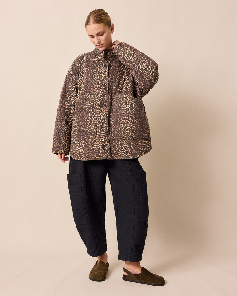 model wears amala black quilted cotton trousers