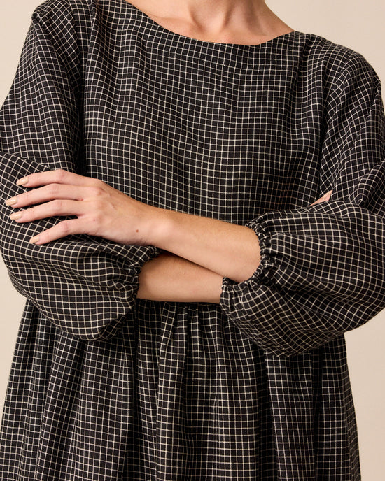 model wears berlin black mini grid linen dress