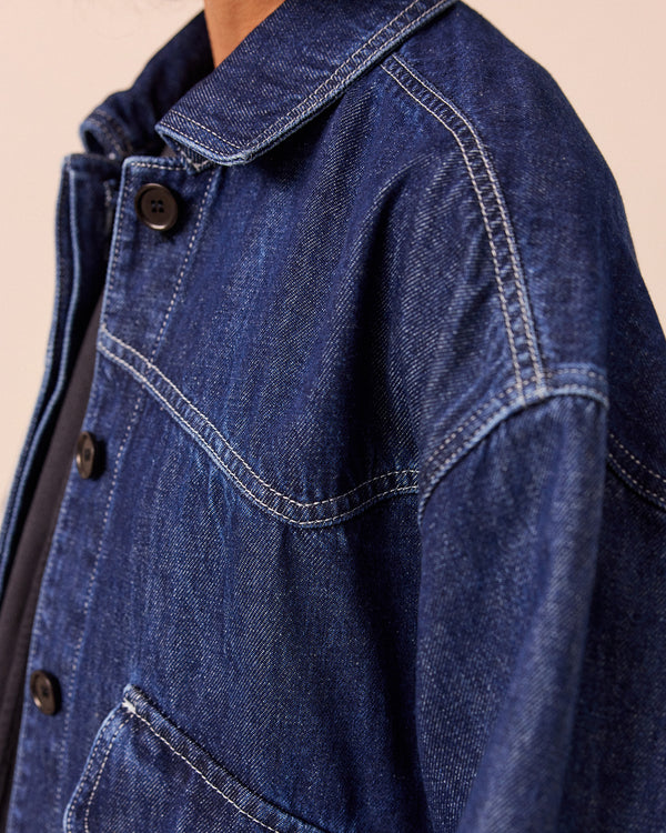 model wears dark wash denim kitty jacket