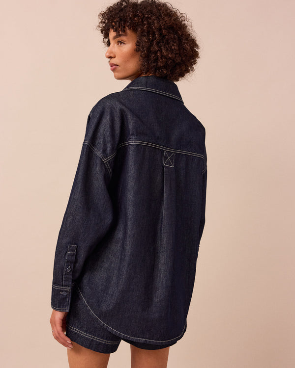 model wears olla indigo wash denim shirt