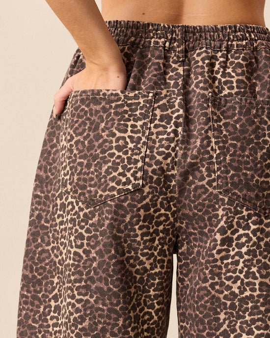 model wears remi leopard print denim jeans