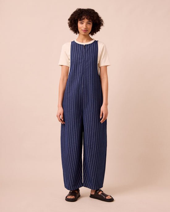 model wears ada mid blue pinstripe denim jumpsuit