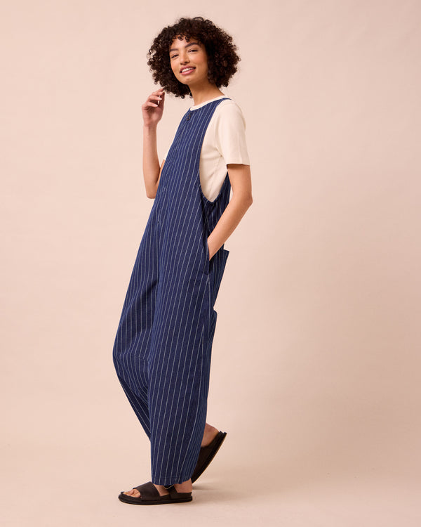 model wears ada mid blue pinstripe denim jumpsuit