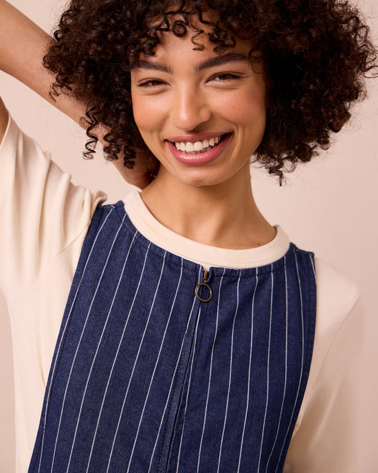 model wears ada mid blue pinstripe denim jumpsuit