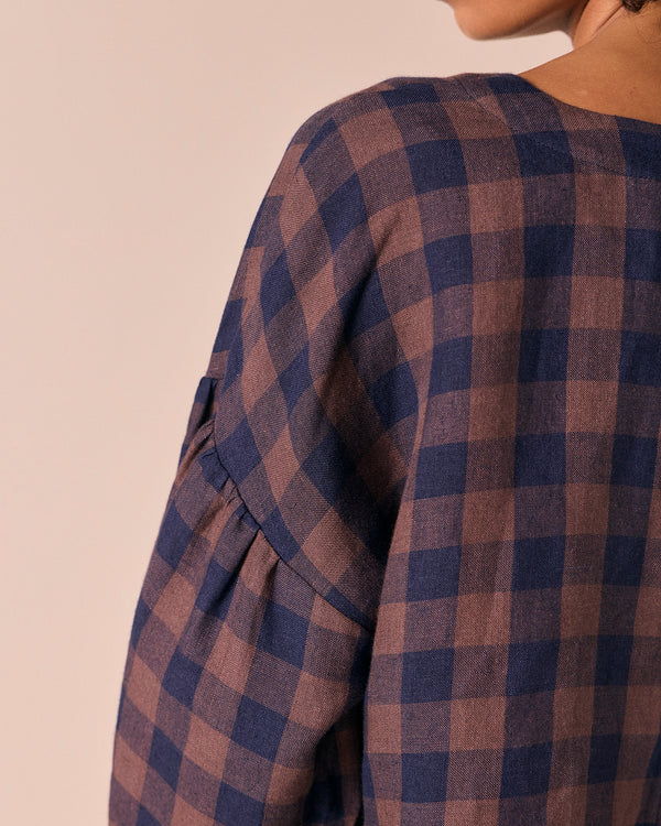 model wears aisha cedar check linen top