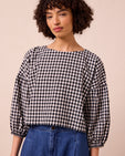 model wears aisha black and white gingham seersucker top