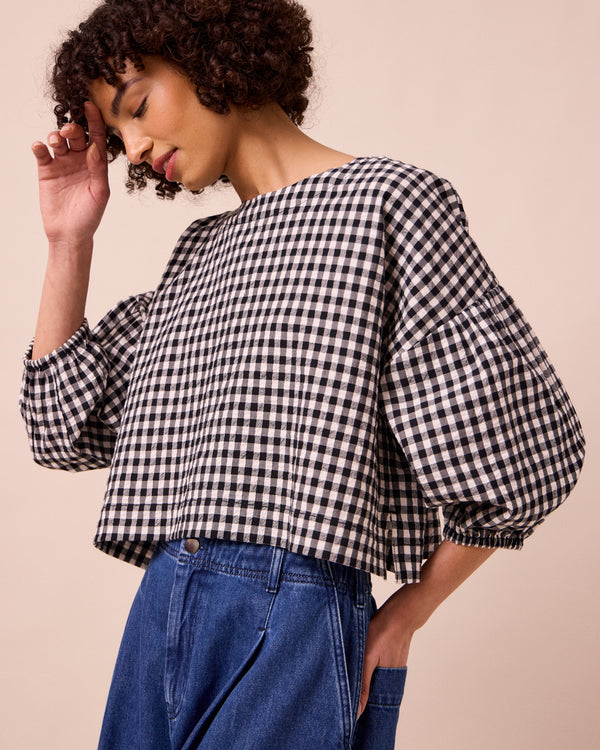 model wears aisha black and white gingham seersucker top