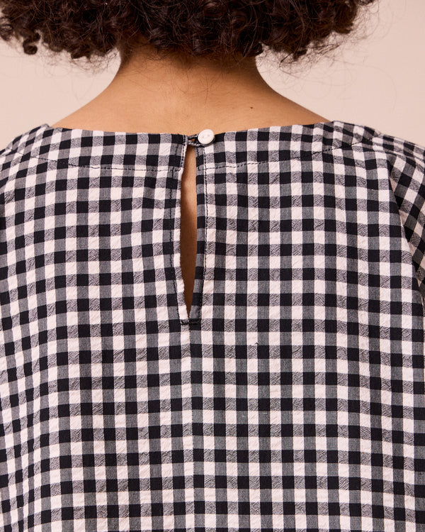 model wears aisha black and white gingham seersucker top