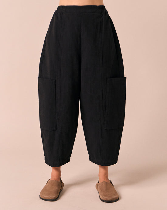 model wears amala black gauze trousers front